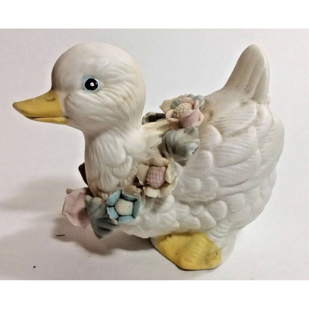 White Duckling wearing garland
